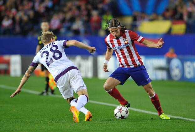 Atletico de Madrid Defender, number 3 FILIPE LUIS - Filipe Luis Kasmirski (26), FK Austria Wien Midfielder, number 28 DANIEL ROYER - (22) - Champions league, soccer match between Atletico de Madrid - FK Austria Wien at the Vicente Calderon estadium, Madrid - Spain by November 6, 2013. GregorioxLopez. 