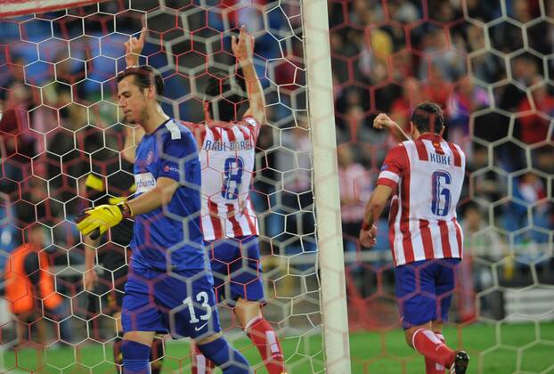 Atletico de Madrid Midfielder, number 8 RAUL GARCIA - Raul Garcia Escudero (26), celebrates after scoring a goal (2-0)Atletico de Madrid Midfielder, number 6 KOKE - Jorge Resurreccion Merodio (20), FK Austria Wien goalkeeper, number 13 HEINZ LINDNER - HEINZ LINDNER (22) - Champions league, soccer match between Atletico de Madrid - FK Austria Wien at the Vicente Calderon estadium, Ma 