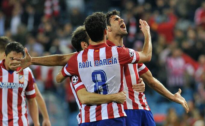 Atletico de Madrid Forward, number 19 DIEGO COSTA - Diego da Silva Costa (24), celebrates after scoring a goal (3-0)Atletico de Madrid Midfielder, number 8 RAUL GARCIA - Raul Garcia Escudero (26) during round 1 of the Champions league, soccer match between Atletico de Madrid - FK Austria Wien at the Vicente Calderon estadium, Madrid - by November 6, 2013. GregorioxLopez. 