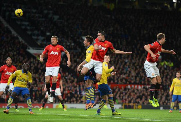Robin van Persie of Manchester United scores the first goal - Barclays Premier League - Manchester United (ManU) vs Arsenal FC London - Old Trafford Stadium - Manchester - England - 10 11 13 - EDITORIAL USE ONLY. No use with unauthorised audio, video, data, fixture lists, club league logos or live services. Online in-match use limited to 120 images, no video emulation. No use in betting, games or single club league player publications.