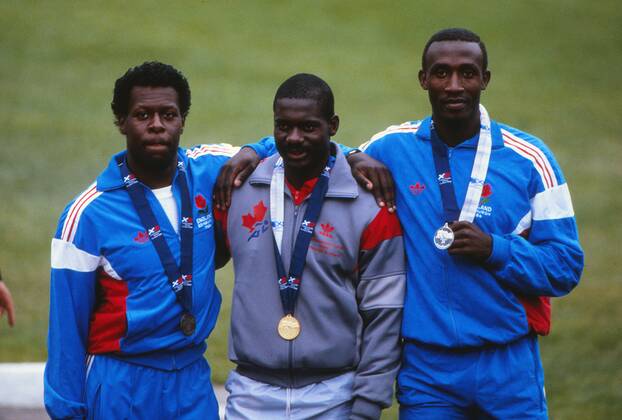 Athletics - 1986 Edinburgh Commonwealth Games - Men s 100m Medal Presentation Left to right: England s Mike McFarlane (bronze), Canada s Ben Johnson (gold) and England s Linford Christie (silver) at Meadowbank Stadium. 