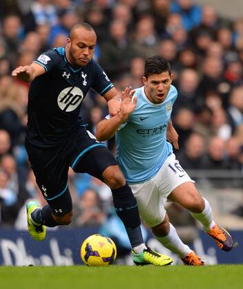Younes Kaboul of Tottenham challenges Sergio Kun Agüero of Manchester City - Barclays Premier League - Manchester City vs Tottenham Hotspur - Etihad Stadium - Manchester - England - 24th November 2013 - EDITORIAL USE ONLY. No use with unauthorised audio, video, data, fixture lists, club league logos or live services. Online in-match use limited to 120 images, no video emulation. No use in betting, games or single club league player publications.