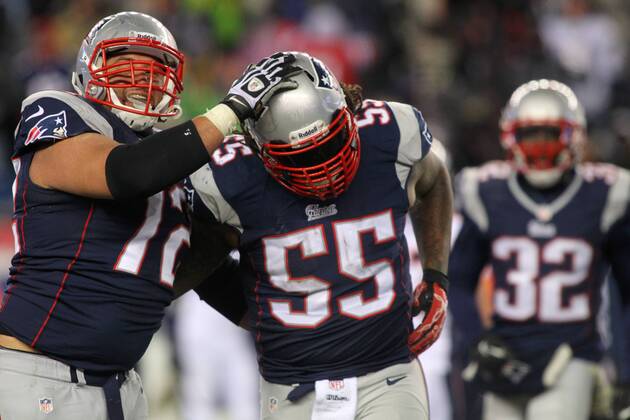 New England Patriots guard Joe Vellano (72) congratulates linebacker Brandon Spikes (55) after spikes recovered a fumble by the Denver Broncos in the third quarter at Gillette Stadium in Foxboro, Massachusetts on November 24, 2013. The Patriots defeated the Broncos 34-31 in overtime.  BOS2013112415