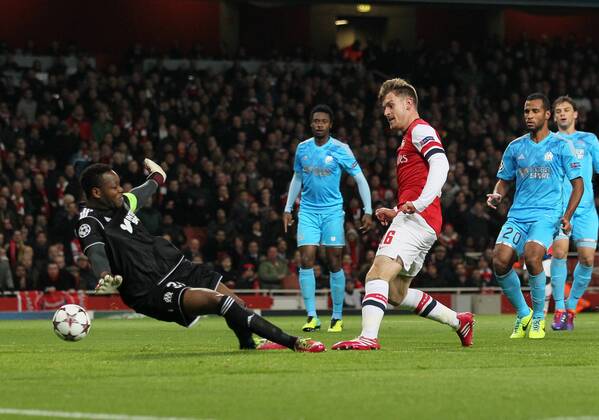 Arsenal s Aaron Ramsey sees his shot saved by Marseille s Steve Mandanda Arsenal FC London v Olympique Marseille - Champions League - Emirates Stadium - London - 26 11 2013 - EDITORIAL USE ONLY. No use with unauthorised audio, video, data, fixture lists, club league logos or live services. Online in-match use limited to 120 images, no video emulation. No use in betting, games or single club league player publications.