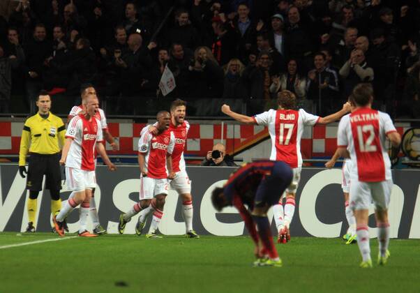 Ajax s Thulani Sereno (C) celebrates his goal with teammates during the UEFA Champions League Group H match between Ajax Amsterdam FC Barcelona at Amsterdam Arena on November 26, 2013 in Amsterdam, Netherlands  PA001