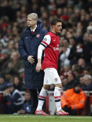Arsenal s Arsene Wenger substitutes Mesut Ozil Arsenal FC London v Olympique Marseille - Champions League - Emirates Stadium - London - 26 11 2013 - EDITORIAL USE ONLY. No use with unauthorised audio, video, data, fixture lists, club league logos or live services. Online in-match use limited to 120 images, no video emulation. No use in betting, games or single club league player publications.