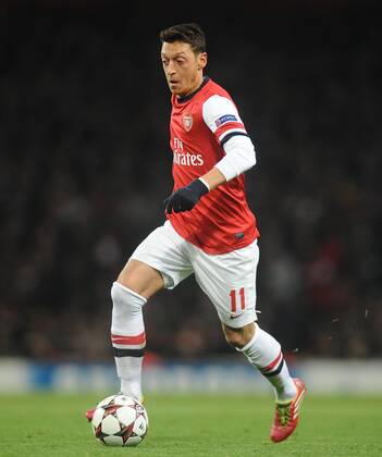 Football - 2013 2014 Champions League - Group F: Arsenal FC London vs. Olympique de Marseille Arsenal s Mesut Ozil on the ball at The Emirates. 