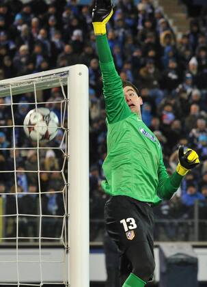 ITAR-TASS: ST PETERSBURG, RUSSIA. NOVEMBER 26, 2013. Atletico s goalie Thibaut Courtois concedes a goal in the UEFA Champions League football match against Zenit St Petersburg at Petrovsky Stadium. The game ended in a 1:1 draw.  premiumd 20158476