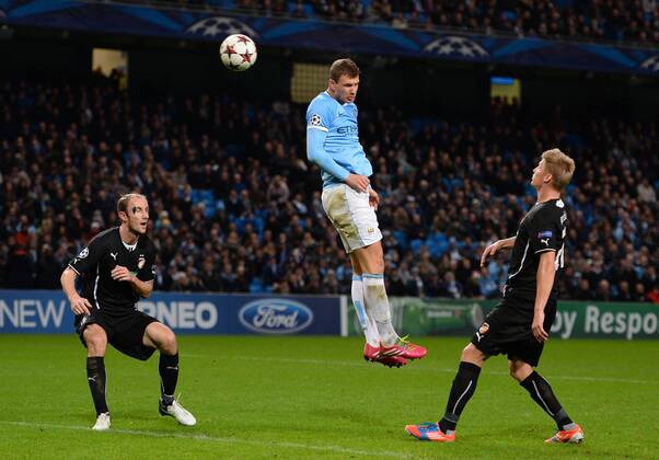 Edin Dzeko of Manchester City scores the fourth goal - UEFA Champions League Group D - Manchester City vs FC Viktoria Plzen - Etihad Stadium - Manchester - England- 27th November 2013 - Picture Simon Bellis Sportimage EDITORIAL USE ONLY. No use with unauthorised audio, video, data, fixture lists, club league logos or live services. Online in-match use limited to 120 images, no video emulation. No use in betting, games or single club league player publications.