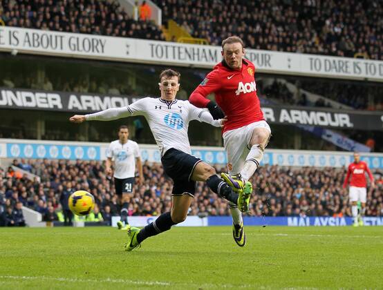 Tottenham s Vlad Chiriches tussles with Manchester United s Wayne Rooney Tottenham Hotspur v Manchester United - Premier League - White Hart Lane - London - 01 12 2013 - Pic David Klein Sportimage EDITORIAL USE ONLY. No use with unauthorised audio, video, data, fixture lists, club league logos or live services. Online in-match use limited to 120 images, no video emulation. No use in betting, games or single club league player publications.