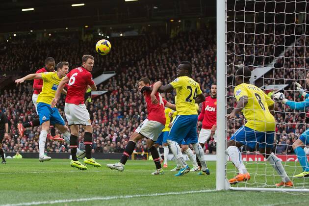 A header from Jonny Evans of Manchester United hits the post - Manchester United vs. Newcastle United - Barclays Premier League - Old Trafford - Manchester - 04 12 2013 Pic Philip Oldham Sportimage EDITORIAL USE ONLY. No use with unauthorised audio, video, data, fixture lists, club league logos or live services. Online in-match use limited to 120 images, no video emulation. No use in betting, games or single club league player publications.