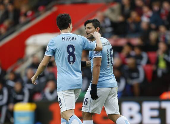 Manchester City s Sergio Kun Aguero celebrates scoring his sides opening goal with Samir Nasri by getting his cheek pinched Southampton v Manchester City - Premier League - St Mary s - Southampton - 07 12 2013 - Pic David Klein Sportimage EDITORIAL USE ONLY. No use with unauthorised audio, video, data, fixture lists, club league logos or live services. Online in-match use limited to 120 images, no video emulation. No use in betting, games or single club league player publications.