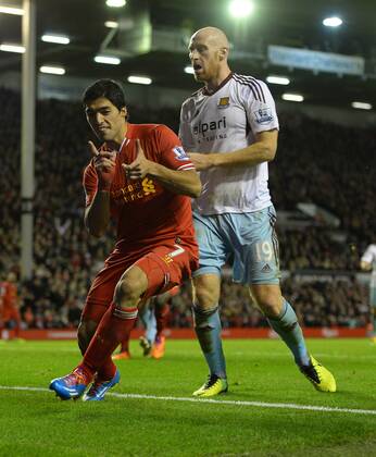 Luis Suarez of Liverpool celebrates the third goal - Barclays Premier League - Liverpool vs West Ham Utd - Anfield Stadium - Liverpool - England - 7th December 2013 - Picture Simon Bellis Sportimage EDITORIAL USE ONLY. No use with unauthorised audio, video, data, fixture lists, club league logos or live services. Online in-match use limited to 120 images, no video emulation. No use in betting, games or single club league player publications.