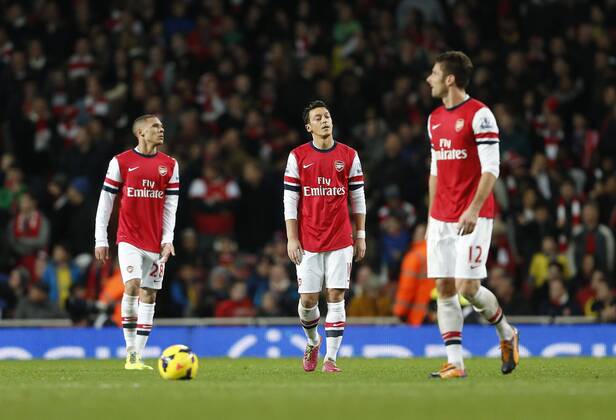 Arsenal s Mesut Ozil looks on dejected after Everton s equaliser Arsenal v Everton - Premier League - Emirates Stadium - London - 08 12 2013 - Pic David Klein Sportimage EDITORIAL USE ONLY. No use with unauthorised audio, video, data, fixture lists, club league logos or live services. Online in-match use limited to 120 images, no video emulation. No use in betting, games or single club league player publications.