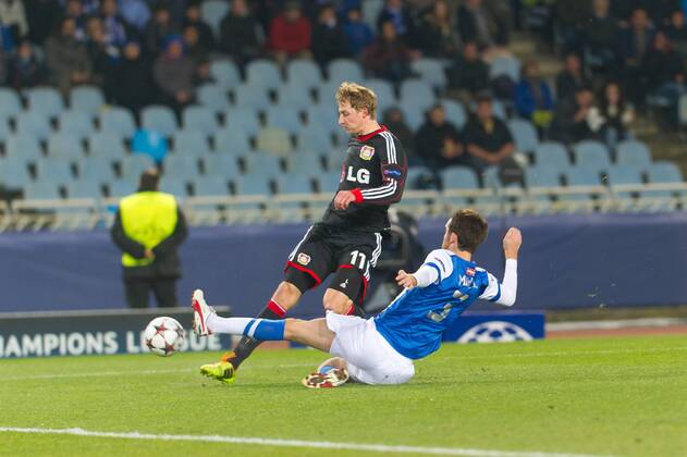 San Sebastian, Spain. 10th December 2013 Bayer 04 Leverkusen s Stefan Kießling (11) and Real Sociedad s Mikel Gonzalez (3) during the UEFA Champions League Group A match between Real Sociedad and Bayer 04 Leverkusen at Anoeta Stadium 