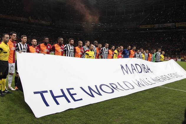 UEFA Champions League group B match between Galatasaray Istanbul and Juventus at Turk Telekom Arena Stadium on December 10, 2013 in Istanbul, Players stand behind a banner for Nelson Mandela. 