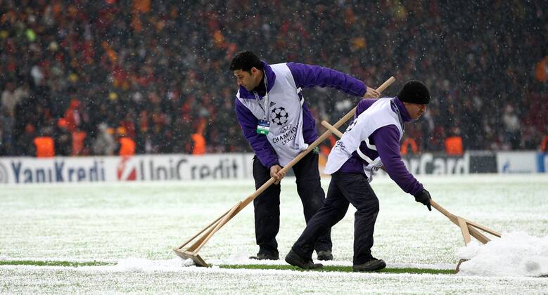 UEFA Champions League group B match between Galatasaray Istanbul and Juventus Turin at Turk Telekom Arena Stadium on December 10, 2013 in Istanbul, Turkey. Pictured: Worker try to clean the ground 
