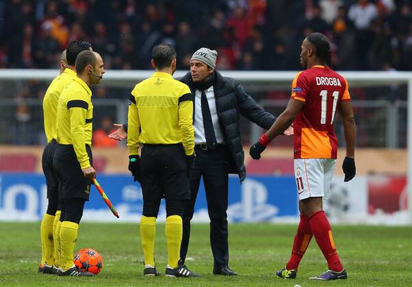 UEFA Champions League group B match between Galatasaray Istanbul and Juventus Torino at Turk Telekom Arena Stadium on December 11, 2013 in Istanbul. Pictured: Didier Drogba of Galatasaray and Coach Antonio Conte of Juventus and referee Pedro Proenca. 