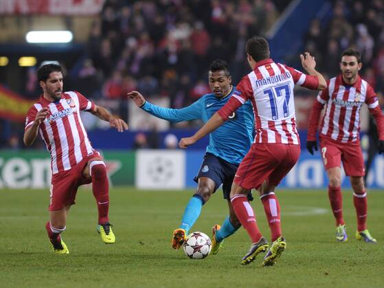FC Porto Defender, number 26 ALEX SANDRO - Alex Sandro (21), Atletico de Madrid Defender, number 17 MANQUILLO - Javier Manquillo Gaitan (18), Atletico de Madrid Midfielder, number 8 RAUL GARCIA - Raul Garcia Escudero (26), Atletico de Madrid Forward, number 7 ADRIAN - Adrian Lopez Alvarez (24) during round 6 of the CHAMPIONS LEAGUE league, soccer match between Atletico de Madrid - 