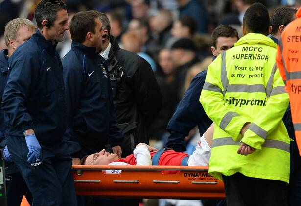 Laurent Koscielny of Arsenal is taken off on a stretcher - Barclays Premier League - Manchester City vs Arsenal - Etihad Stadium - Manchester - England - 14th December 2013 - Picture Simon Bellis Sportimage EDITORIAL USE ONLY. No use with unauthorised audio, video, data, fixture lists, club league logos or live services. Online in-match use limited to 120 images, no video emulation. No use in betting, games or single club league player publications.