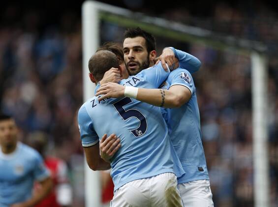 Manchester City s Alvaro Negredo celebrates scoring his sides second goal Manchester City vs Arsenal - Premier League - Etihad Stadium - Manchester - England - 14 12 2013 - Pic David Klein Sportimage EDITORIAL USE ONLY. No use with unauthorised audio, video, data, fixture lists, club league logos or live services. Online in-match use limited to 120 images, no video emulation. No use in betting, games or single club league player publications.