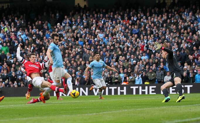 Manchester City s Alvaro Negredo scoring his sides second goal Manchester City vs Arsenal - Premier League - Etihad Stadium - Manchester - England - 14 12 2013 - Pic David Klein Sportimage EDITORIAL USE ONLY. No use with unauthorised audio, video, data, fixture lists, club league logos or live services. Online in-match use limited to 120 images, no video emulation. No use in betting, games or single club league player publications.