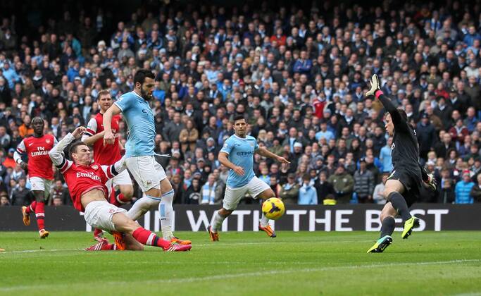 Manchester City s Alvaro Negredo scoring his sides second goal Manchester City vs Arsenal - Premier League - Etihad Stadium - Manchester - England - 14 12 2013 - Pic David Klein Sportimage EDITORIAL USE ONLY. No use with unauthorised audio, video, data, fixture lists, club league logos or live services. Online in-match use limited to 120 images, no video emulation. No use in betting, games or single club league player publications.