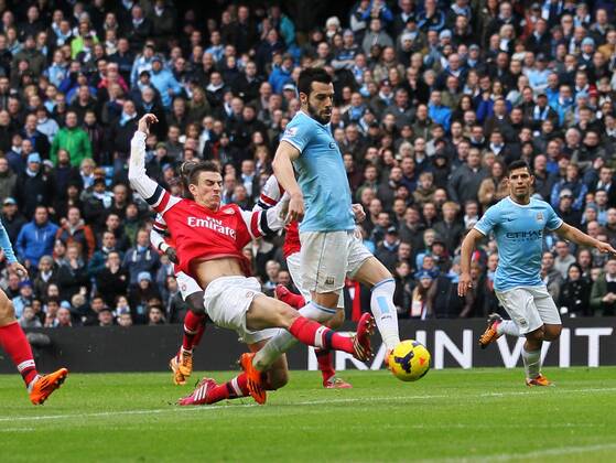 Manchester City s Alvaro Negredo scoring his sides second goal Manchester City vs Arsenal - Premier League - Etihad Stadium - Manchester - England - 14 12 2013 - Pic David Klein Sportimage EDITORIAL USE ONLY. No use with unauthorised audio, video, data, fixture lists, club league logos or live services. Online in-match use limited to 120 images, no video emulation. No use in betting, games or single club league player publications.