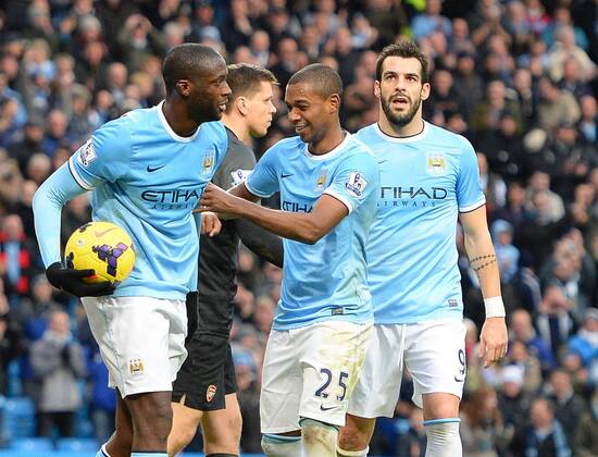 Yaya Toure of Manchester City celebrates scoring the sixth goal - Barclays Premier League - Manchester City vs Arsenal - Etihad Stadium - Manchester - England - 14th December 2013 - Picture Simon Bellis Sportimage EDITORIAL USE ONLY. No use with unauthorised audio, video, data, fixture lists, club league logos or live services. Online in-match use limited to 120 images, no video emulation. No use in betting, games or single club league player publications.
