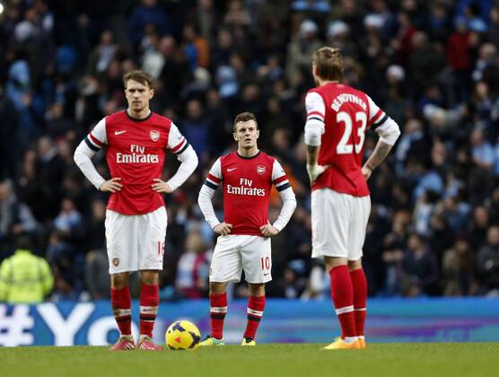Arsenal s Jack Wilshere looks on dejected after going 6-3 down Manchester City vs Arsenal - Premier League - Etihad Stadium - Manchester - England - 14 12 2013 - Pic David Klein Sportimage EDITORIAL USE ONLY. No use with unauthorised audio, video, data, fixture lists, club league logos or live services. Online in-match use limited to 120 images, no video emulation. No use in betting, games or single club league player publications.