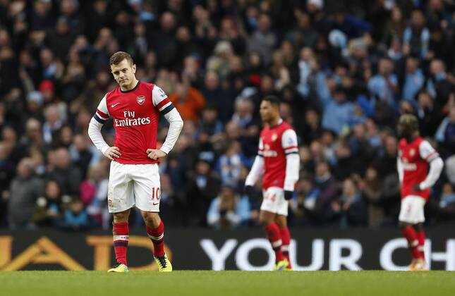 Arsenal s Jack Wilshere looks on dejected after going 6-3 down Manchester City vs Arsenal - Premier League - Etihad Stadium - Manchester - England - 14 12 2013 - Pic David Klein Sportimage EDITORIAL USE ONLY. No use with unauthorised audio, video, data, fixture lists, club league logos or live services. Online in-match use limited to 120 images, no video emulation. No use in betting, games or single club league player publications.
