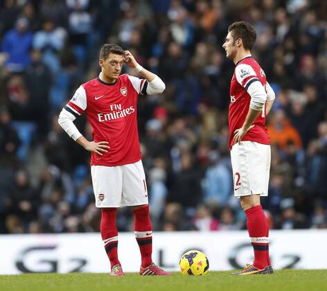 Arsenal s Mesut Ozil and Olivier Giroud look on dejected after going 4-2 down Manchester City vs Arsenal - Premier League - Etihad Stadium - Manchester - England - 14 12 2013 - Pic David Klein Sportimage EDITORIAL USE ONLY. No use with unauthorised audio, video, data, fixture lists, club league logos or live services. Online in-match use limited to 120 images, no video emulation. No use in betting, games or single club league player publications.