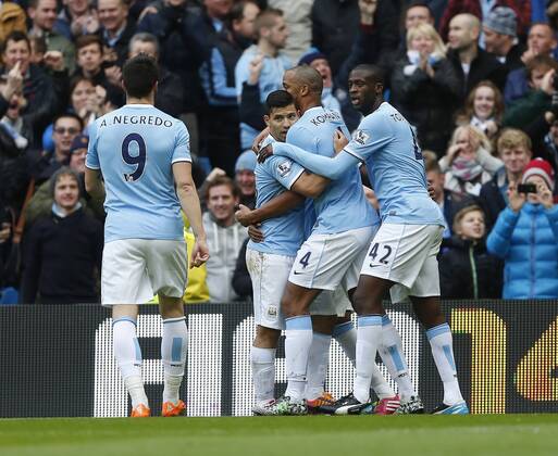 Manchester City s Sergio Kun Agüero celebrates scoring his sides opening goal Manchester City vs Arsenal - Premier League - Etihad Stadium - Manchester - England - 14 12 2013 - EDITORIAL USE ONLY. No use with unauthorised audio, video, data, fixture lists, club league logos or live services. Online in-match use limited to 120 images, no video emulation. No use in betting, games or single club league player publications.