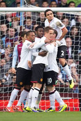 Danny Welbeck of Manchester United is mobbed in celebration of his opening goal - Aston Villa vs. Manchester United, ManU - Barclays Premier League - Villa Park - Birmingham - 15 12 2013 Pic PhilipxOldham Sportimage EDITORIAL USE ONLY. No use with unauthorised audio, video, data, fixture lists, club league logos or live services. Online in-match use limited to 120 images, no video emulation. No use in betting, games or single club league player publications.