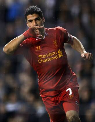 Luis Suarez of Liverpool celebrates scoring their fourth goal during the Barclays Premier League match between Tottenham Hotspur and Liverpool at White Hart Lane in London, Britain on Dec. 15, 2013. Liverpool won 5-0. (Xinhua Wang Lili) FOR EDITORIAL USE ONLY. NOT FOR SALE FOR MARKETING OR ADVERTISING CAMPAIGNS. NO USE WITH UNAUTHORIZED AUDIO, VIDEO, DATA, FIXTURE LISTS, CLUB LEAGUE LOGOS OR LIVE SERVICES. ONLINE IN-MATCH USE LIMITED TO 45 IMAGES, NO VIDEO EMULATION. NO USE IN BETTING, GAMES OR SINGLE CLUB LEAGUE PLAYER PUBLICATIONS. (SP)BRITAIN-LONDON-SOCCER-PREMIER LEAGUE-TOTTENHAM HOTSPUR VS LIVERPOOL