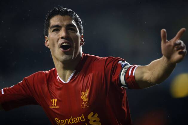 Luis Suarez of Liverpool celebrates scoring their fourth goal during the Barclays Premier League match between Tottenham Hotspur and Liverpool at White Hart Lane in London, Britain on Dec. 15, 2013. Liverpool won 5-0. (Xinhua Wang Lili) FOR EDITORIAL USE ONLY. NOT FOR SALE FOR MARKETING OR ADVERTISING CAMPAIGNS. NO USE WITH UNAUTHORIZED AUDIO, VIDEO, DATA, FIXTURE LISTS, CLUB LEAGUE LOGOS OR LIVE SERVICES. ONLINE IN-MATCH USE LIMITED TO 45 IMAGES, NO VIDEO EMULATION. NO USE IN BETTING, GAMES OR SINGLE CLUB LEAGUE PLAYER PUBLICATIONS. (SP)BRITAIN-LONDON-SOCCER-PREMIER LEAGUE-TOTTENHAM HOTSPUR VS LIVERPOOL