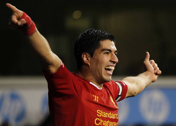 Luis Suarez of Liverpool celebrates scoring their fourth goal during the Barclays Premier League match between Tottenham Hotspur and Liverpool at White Hart Lane in London, Britain on Dec. 15, 2013. Liverpool won 5-0. (Xinhua Wang Lili) FOR EDITORIAL USE ONLY. NOT FOR SALE FOR MARKETING OR ADVERTISING CAMPAIGNS. NO USE WITH UNAUTHORIZED AUDIO, VIDEO, DATA, FIXTURE LISTS, CLUB LEAGUE LOGOS OR LIVE SERVICES. ONLINE IN-MATCH USE LIMITED TO 45 IMAGES, NO VIDEO EMULATION. NO USE IN BETTING, GAMES OR SINGLE CLUB LEAGUE PLAYER PUBLICATIONS. (SP)BRITAIN-LONDON-SOCCER-PREMIER LEAGUE-TOTTENHAM HOTSPUR VS LIVERPOOL