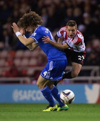 Emanuele Giaccherini of Sunderland collides with David Luiz of Chelsea - Sunderland vs. Chelsea - Capital One League Cup - Stadium of Light - Sunderland - 17 12 2013 Pic Philip Oldham Sportimage EDITORIAL USE ONLY. No use with unauthorised audio, video, data, fixture lists, club league logos or live services. Online in-match use limited to 120 images, no video emulation. No use in betting, games or single club league player publications.