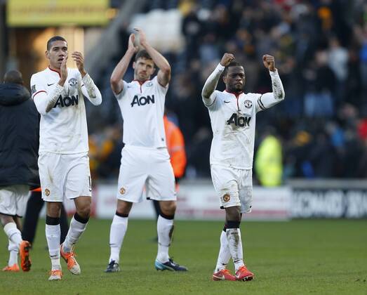 Manchester United s Patrice Evra celebrates at the final whistle Hull City vs Manchester United - Premier League - KC Stadium - London - England - 26 12 2013 - Pic David Klein Sportimage EDITORIAL USE ONLY. No use with unauthorised audio, video, data, fixture lists, club league logos or live services. Online in-match use limited to 120 images, no video emulation. No use in betting, games or single club league player publications.