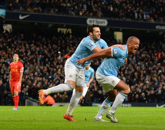 Vincent Kompany of Manchester City celebrates the equalising goal - Barclays Premier League - Manchester City vs Liverpool - Etihad Stadium - Manchester - England - 26th December 2013 - Picture Simon Bellis Sportimage EDITORIAL USE ONLY. No use with unauthorised audio, video, data, fixture lists, club league logos or live services. Online in-match use limited to 120 images, no video emulation. No use in betting, games or single club league player publications.