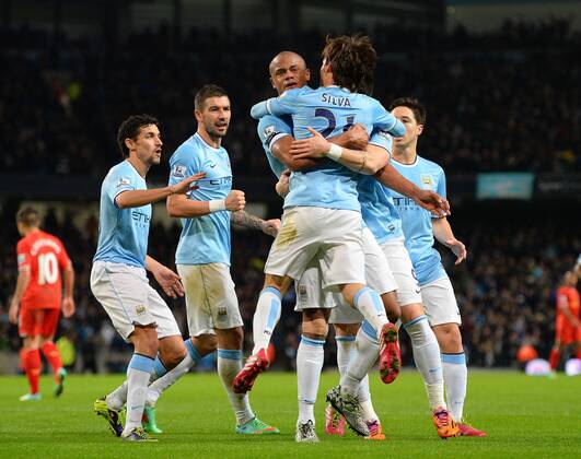 Vincent Kompany of Manchester City celebrates the equalising goal - Barclays Premier League - Manchester City vs Liverpool - Etihad Stadium - Manchester - England - 26th December 2013 - Picture Simon Bellis Sportimage EDITORIAL USE ONLY. No use with unauthorised audio, video, data, fixture lists, club league logos or live services. Online in-match use limited to 120 images, no video emulation. No use in betting, games or single club league player publications.