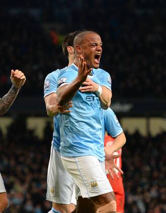 Vincent Kompany of Manchester City celebrates the equalising goal - Barclays Premier League - Manchester City vs Liverpool - Etihad Stadium - Manchester - England - 26th December 2013 - Picture Simon Bellis Sportimage EDITORIAL USE ONLY. No use with unauthorised audio, video, data, fixture lists, club league logos or live services. Online in-match use limited to 120 images, no video emulation. No use in betting, games or single club league player publications.