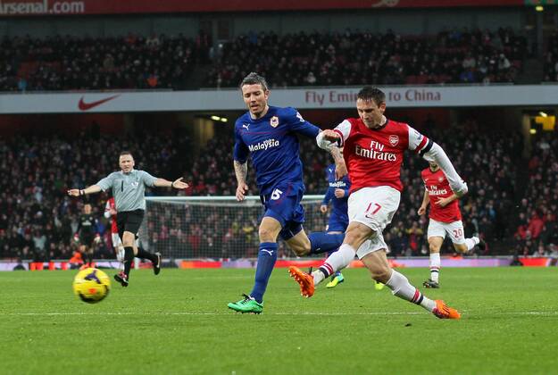 Arsenal s Nacho Monreal fires in a shot Arsenal vs Cardiff - Premier League - Emirates Stadium- London - England - 01 01 2014 - Pic David Klein Sportimage EDITORIAL USE ONLY. No use with unauthorised audio, video, data, fixture lists, club league logos or live services. Online in-match use limited to 120 images, no video emulation. No use in betting, games or single club league player publications.
