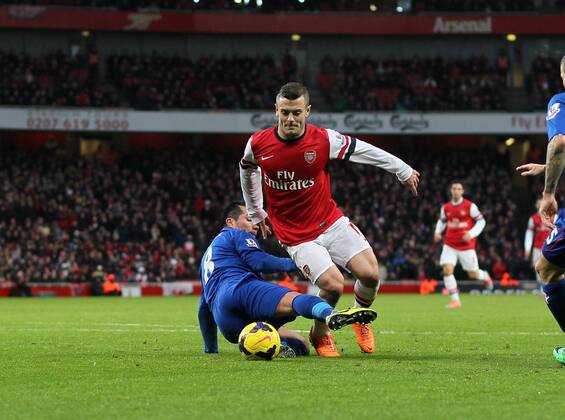 Arsenal s Jack Wilshere gets caught by Cardiff s Gary Medel but no penalty is given Arsenal vs Cardiff - Premier League - Emirates Stadium- London - England - 01 01 2014 - Pic David Klein Sportimage EDITORIAL USE ONLY. No use with unauthorised audio, video, data, fixture lists, club league logos or live services. Online in-match use limited to 120 images, no video emulation. No use in betting, games or single club league player publications.