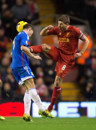 Steven Gerrard of Liverpool puts in a high tackle on Hull s James Chester - Liverpool vs. Hull City - Barclays Premier League - Anfield - Liverpool - 01 01 2014 Pic Philip Oldham Sportimage EDITORIAL USE ONLY. No use with unauthorised audio, video, data, fixture lists, club league logos or live services. Online in-match use limited to 120 images, no video emulation. No use in betting, games or single club league player publications.