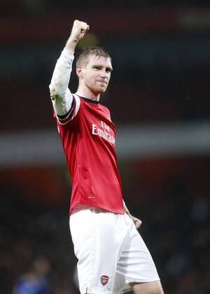 Arsenal s Per Mertesacker celebrates at the final whistle Arsenal vs Cardiff - Premier League - Emirates Stadium- London - England - 01 01 2014 - Pic David Klein Sportimage EDITORIAL USE ONLY. No use with unauthorised audio, video, data, fixture lists, club league logos or live services. Online in-match use limited to 120 images, no video emulation. No use in betting, games or single club league player publications.