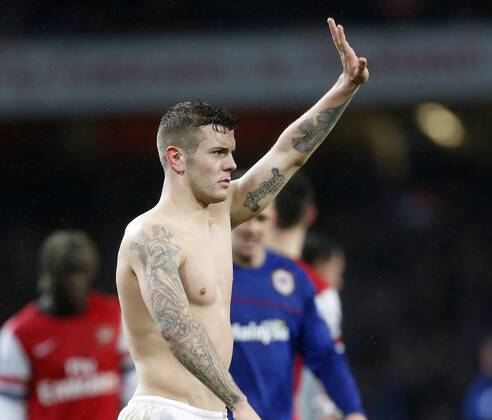 Arsenal s Jack Wilshere shows off his tattoos at the final whistle Arsenal vs Cardiff - Premier League - Emirates Stadium- London - England - 01 01 2014 - Pic David Klein Sportimage EDITORIAL USE ONLY. No use with unauthorised audio, video, data, fixture lists, club league logos or live services. Online in-match use limited to 120 images, no video emulation. No use in betting, games or single club league player publications.