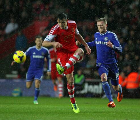 Football - 2013 2014 Premier League - Southampton vs. Chelsea Southampton s Dejan Lovren clears from Andre Schurrle of Chelsea at St Mary s Stadium Southampton Colorsport Shaun Boggust 