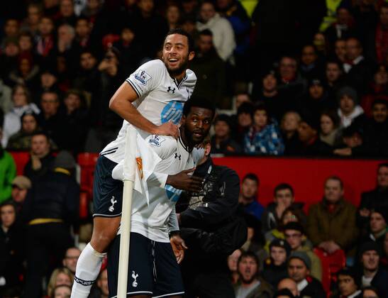 Emmanuel Adebayor of Tottenham celebrates his goal with Mousa Dembele of Tottenham - Barclays Premier League - Manchester Utd vs Tottenham - Old Trafford Stadium - Manchester - England - 1st January 2014 - Picture Simon Bellis Sportimage EDITORIAL USE ONLY. No use with unauthorised audio, video, data, fixture lists, club league logos or live services. Online in-match use limited to 120 images, no video emulation. No use in betting, games or single club league player publications.