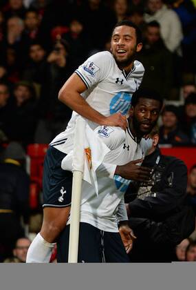 Emmanuel Adebayor of Tottenham celebrates his goal with Mousa Dembele of Tottenham - Barclays Premier League - Manchester Utd vs Tottenham - Old Trafford Stadium - Manchester - England - 1st January 2014 - Picture Simon Bellis Sportimage EDITORIAL USE ONLY. No use with unauthorised audio, video, data, fixture lists, club league logos or live services. Online in-match use limited to 120 images, no video emulation. No use in betting, games or single club league player publications.
